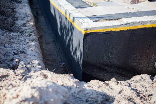 Professional Basement Waterproofing technician working in Laingsburg, MI